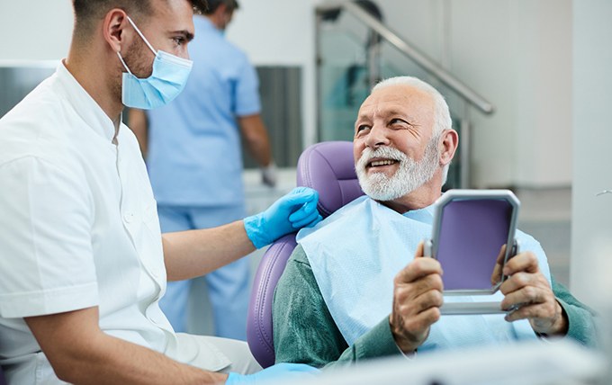 Man at the dentist’s office smiling